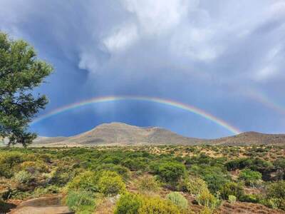 landscape-with-mountainrange-and-rainbow