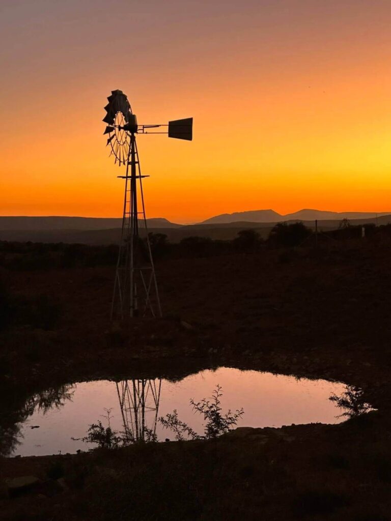 meerlust-windpump-with-mountains-sunset-orange