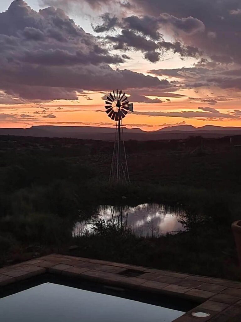 meerlust-windpump-with-mountains-sunset-golden-pink